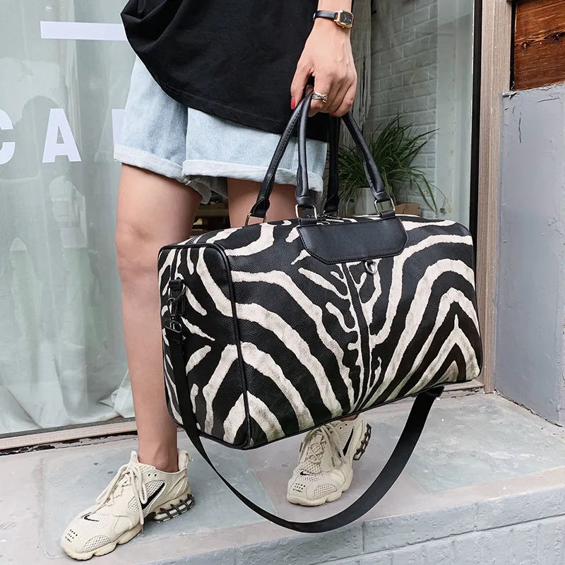 Large women's zebra pattern carry-on suitcase